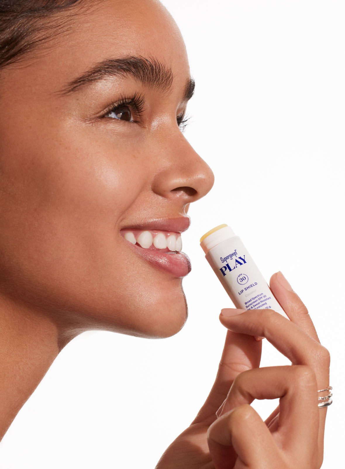 Lip Shield SPF 30 Trio model applying / Coconut / Strawberry / Mint